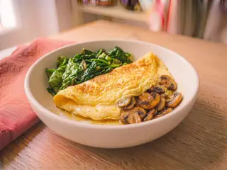 Soft mushroom omelet with green salad