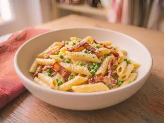 Carbonara-style pasta with bacon and peas