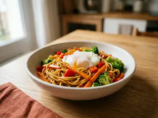 Stir-fried noodles with crunchy veggies and a poached egg