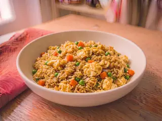 Cantonese fried rice with scrambled eggs and mixed peas and carrots