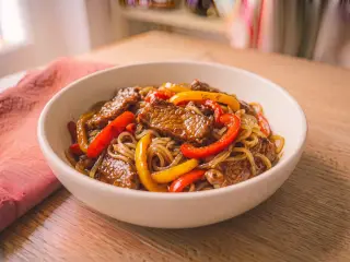 Beef and bell pepper stir-fry with rice noodles
